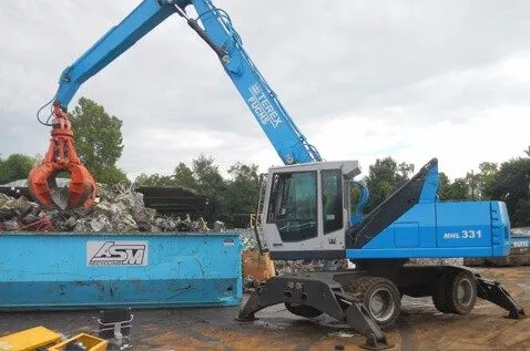 Crane moving scrap metal